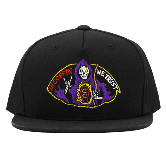 The saint grim reaper throwing up rock n' roll sign while a coffin burns with truth. In coffin we trust, fuel the fire! Embroidery on Cruise Coffin snapback. Ride the darkside!